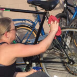 A volunteer readies a finished bicycle. Project Broken Wheel has donated more than 800 bicycles back into the community over the years.