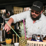 Jesse Hedberg creating Tiki cocktails for the event.