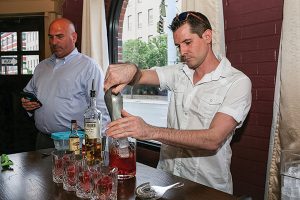 Jerome Daigneault of Filomena’s On Main preparing his cocktail next to Jeff Conelius, Allan S. Goodman.