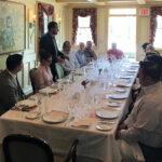 Pierre Casenave (standing) welcoming guests to the trade luncheon at Bernard’s in Ridgefield on May 4.