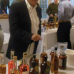 Howard Asadow, District Sales Manager, Allan S. Goodman pouring tastes from Onyx Spirits Company.