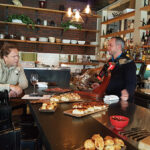 Ben Lloyd, Chef, The Salted Slate serving small bites to Chris Bender, Owner, Stoneacre Pantry in Newport.