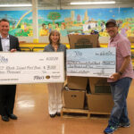 The check presentation and the 604 pounds of food delivered to the RI Community Food Bank. Timothy Burke, Division Manager Northeast, Tito’s Handmade Vodka; Lisa Rothblackman, Chief Philanthropy Officer, RI Community Food Bank; Frank Martucci, General Manager of Beverage Operations, Twin River Casino.